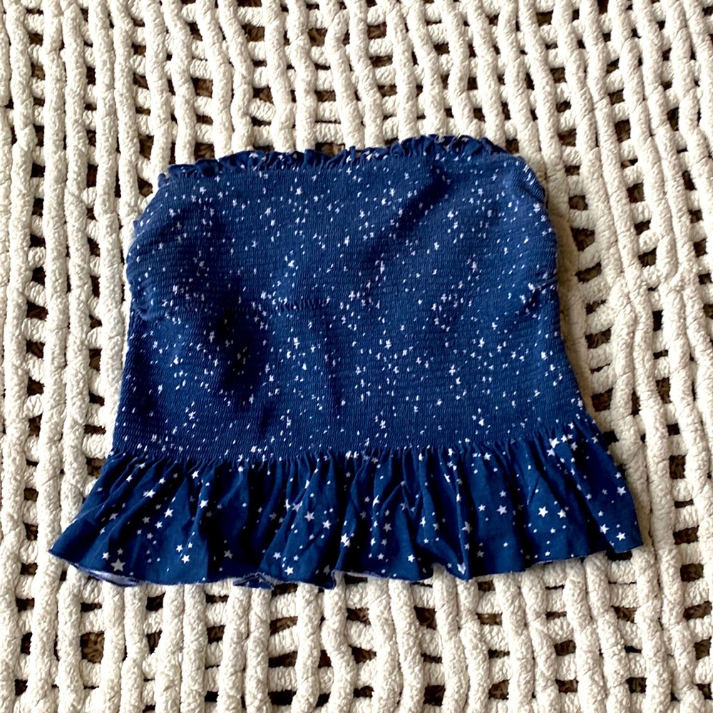This is a blue and white sleeve less crop top